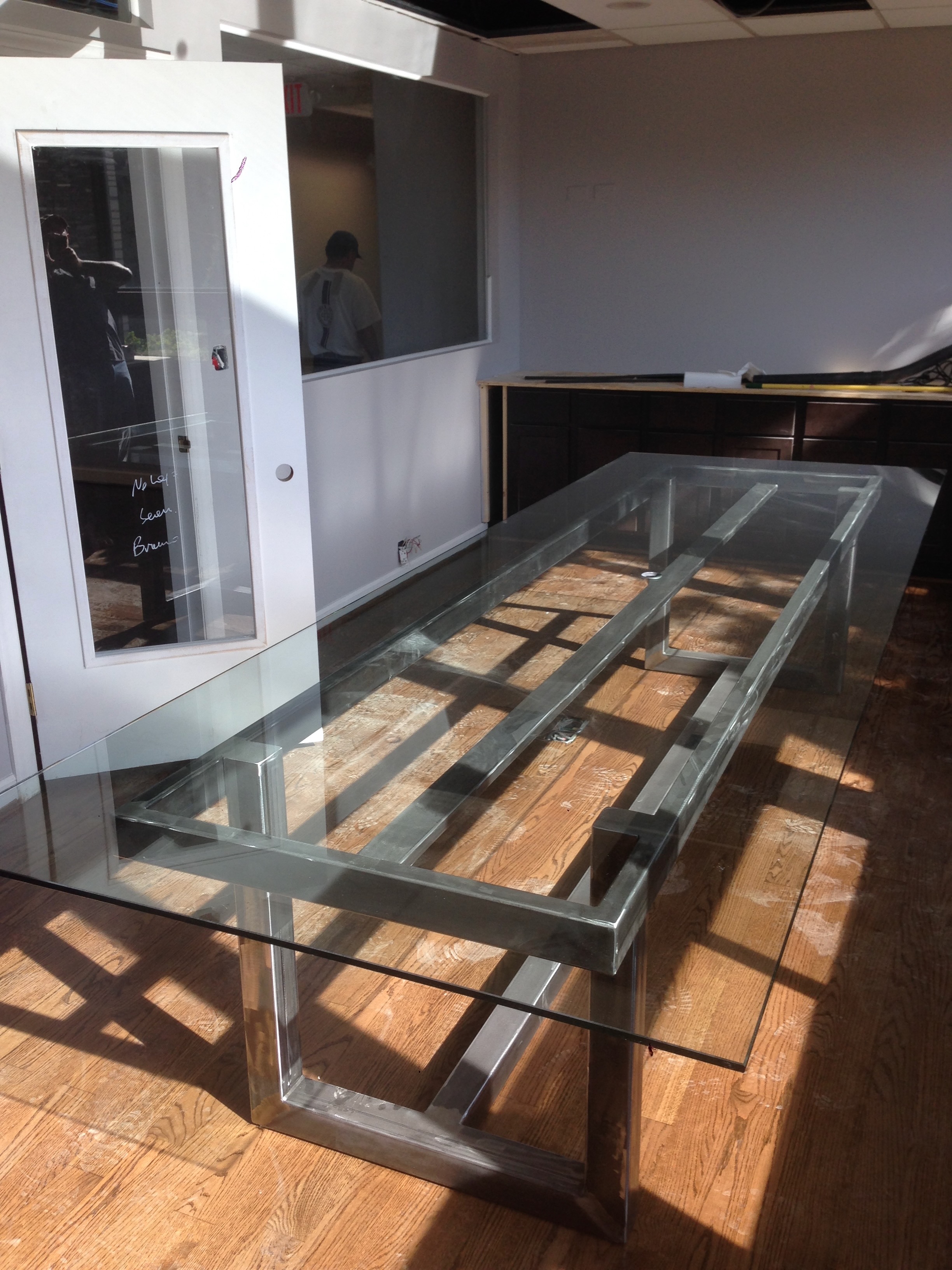 Custom metal-and-glass table from Breuder Design archive