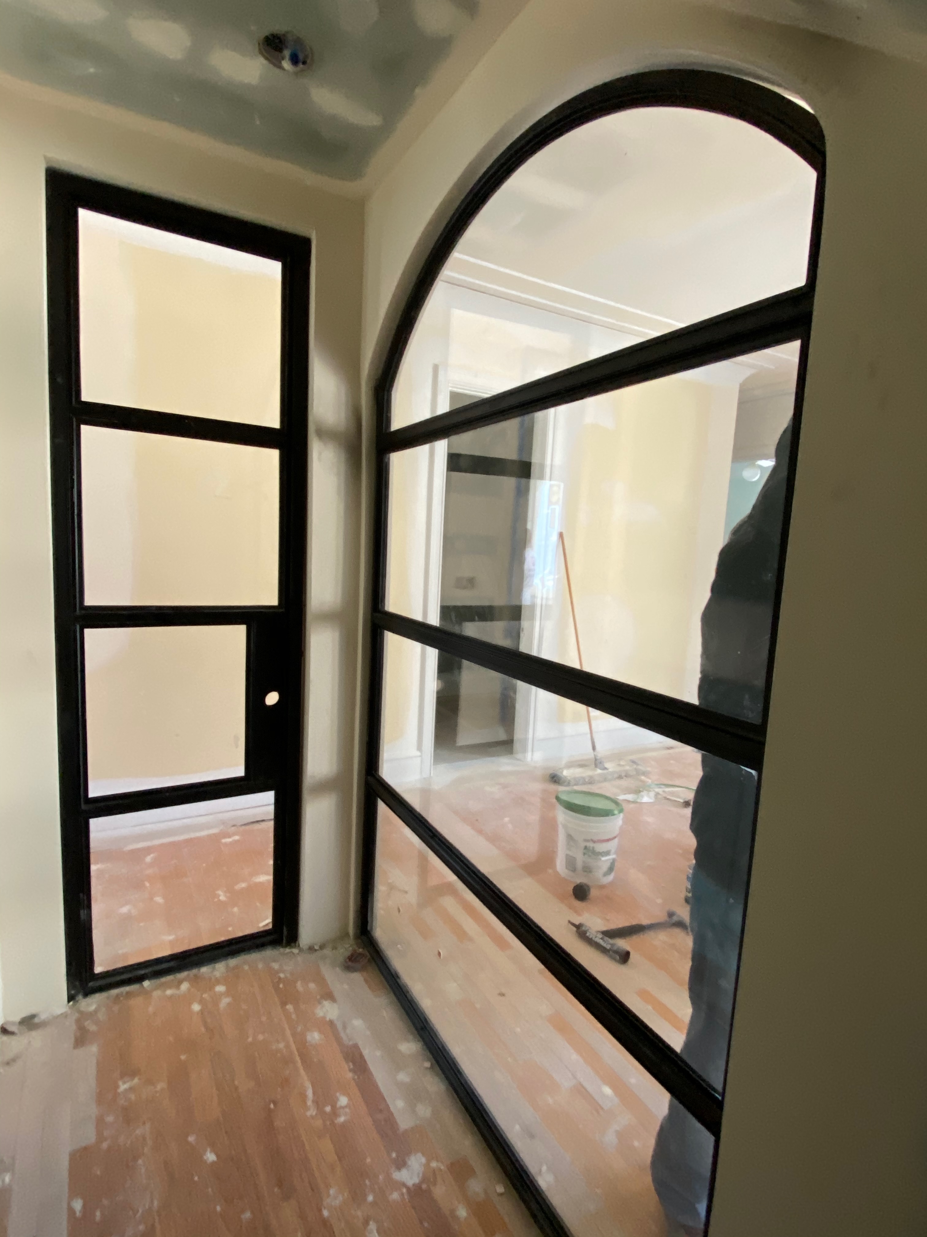 Close-up of the steel partition grid and arched opening