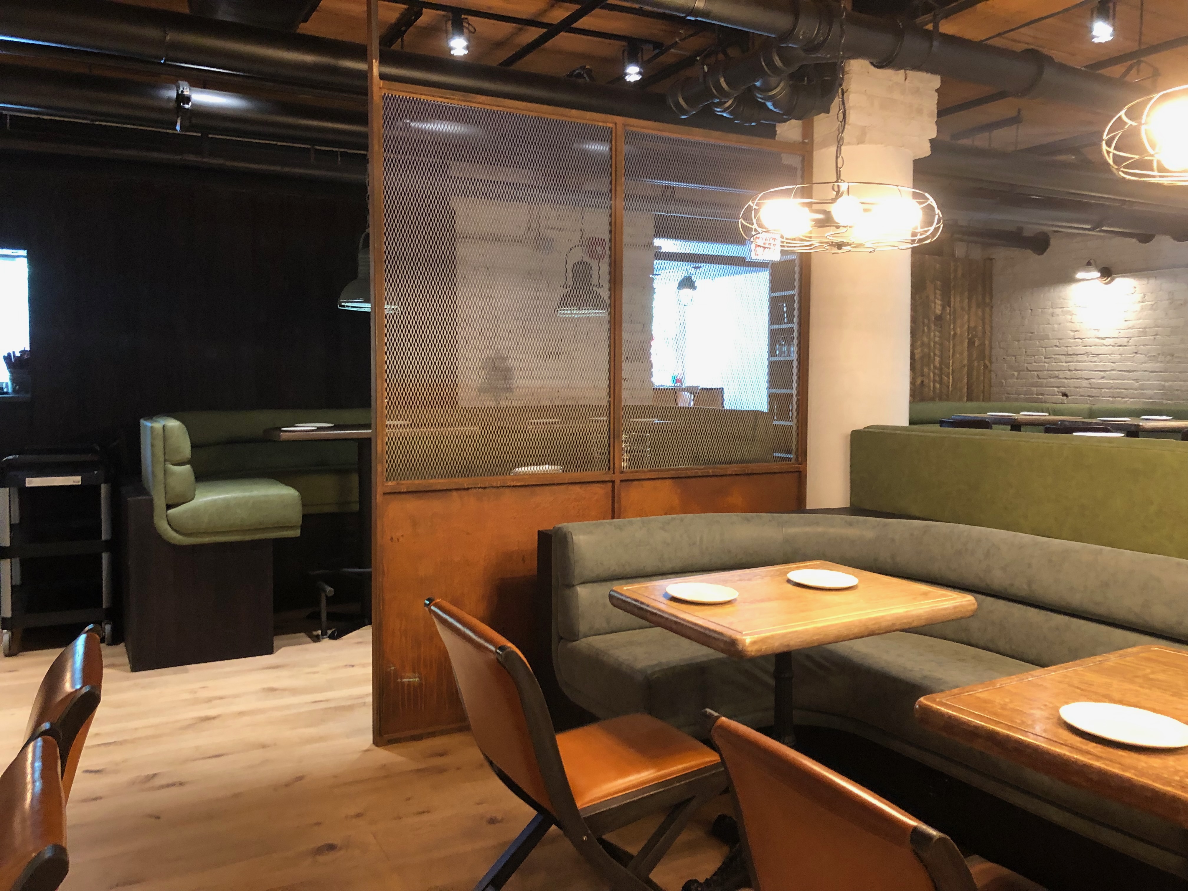 Banquette seating and custom partition detail at Roberts Pizza