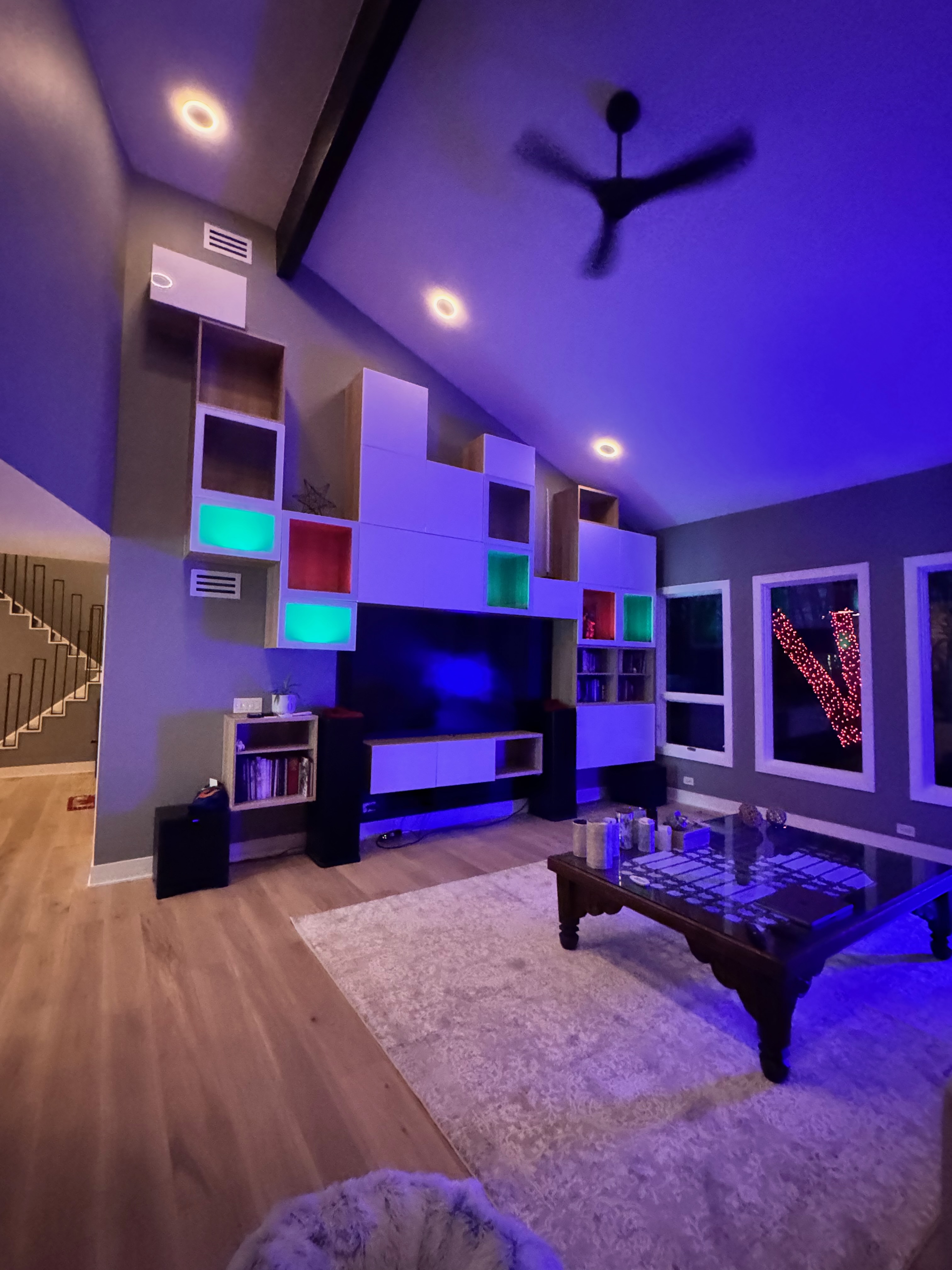 Custom built-ins and wall composition carried through with consistent detailing