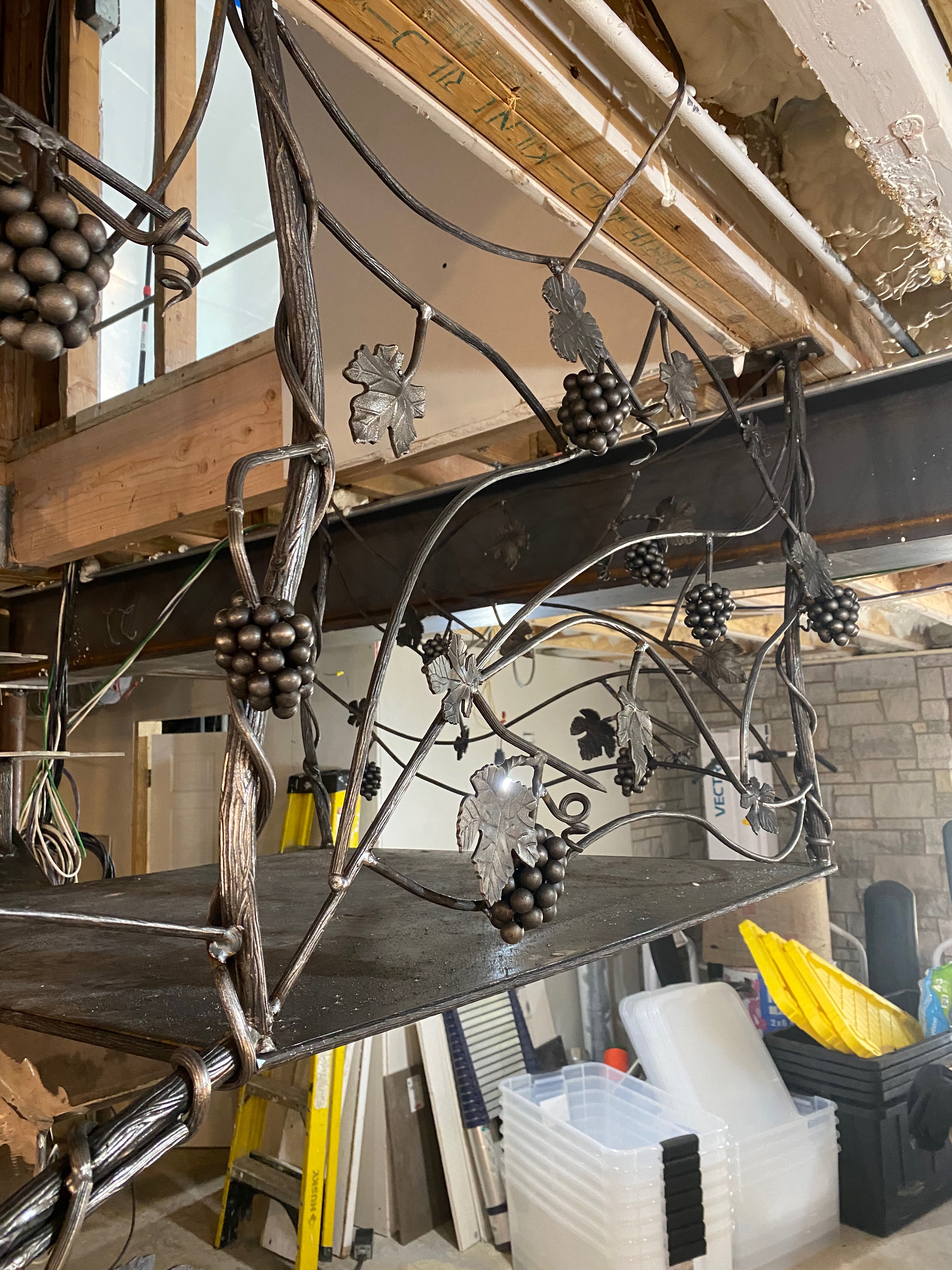 Close-up of forged grapevine forms and clusters